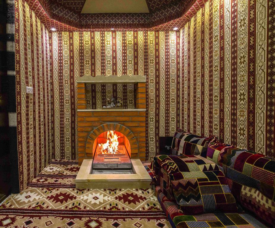 Rest Night Serviced Apartments- Alhamra Riyadh Exterior photo A majlis with a fireplace