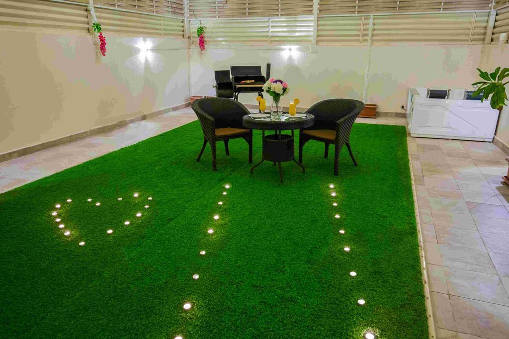 Rest Night Serviced Apartments- Alhamra Riyadh Exterior photo Artificial grass in a home